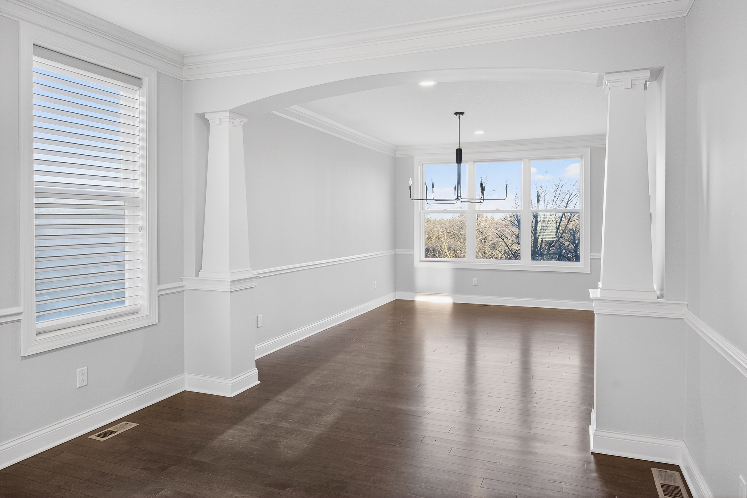 Formal dining room with wainscoting and hardwood floors