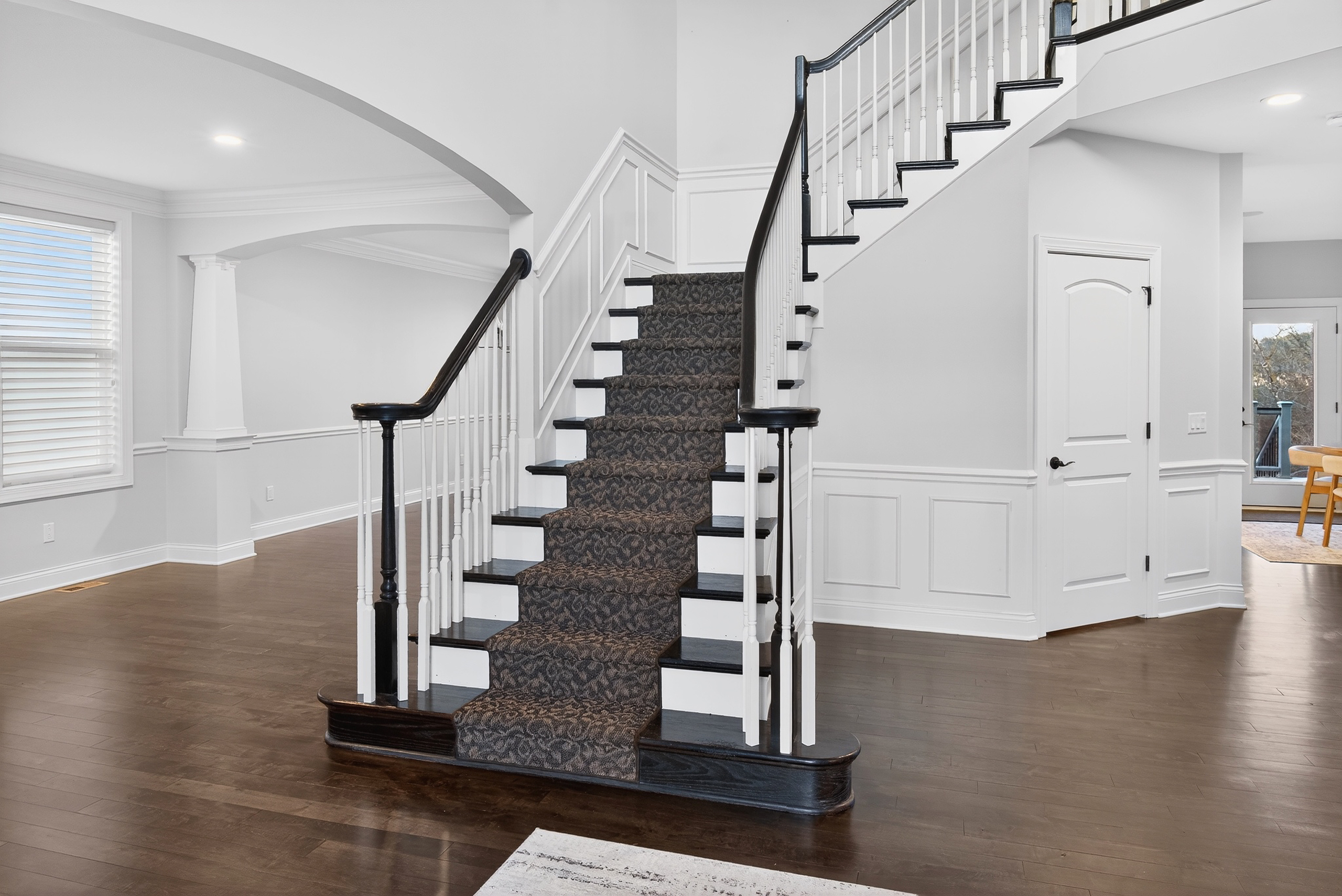 Primary bedroom with ceiling fan and French doors