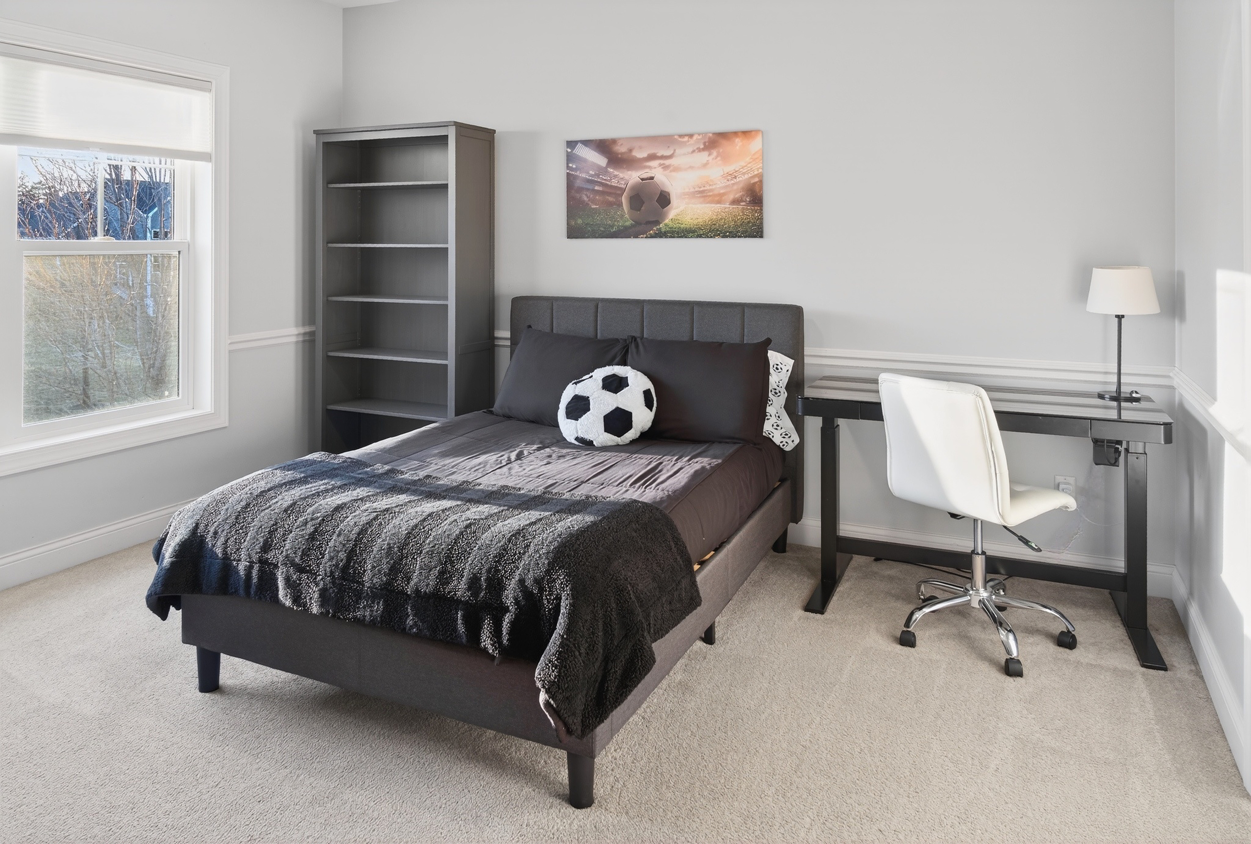 Upper level bedroom with loft bed and ceiling fan