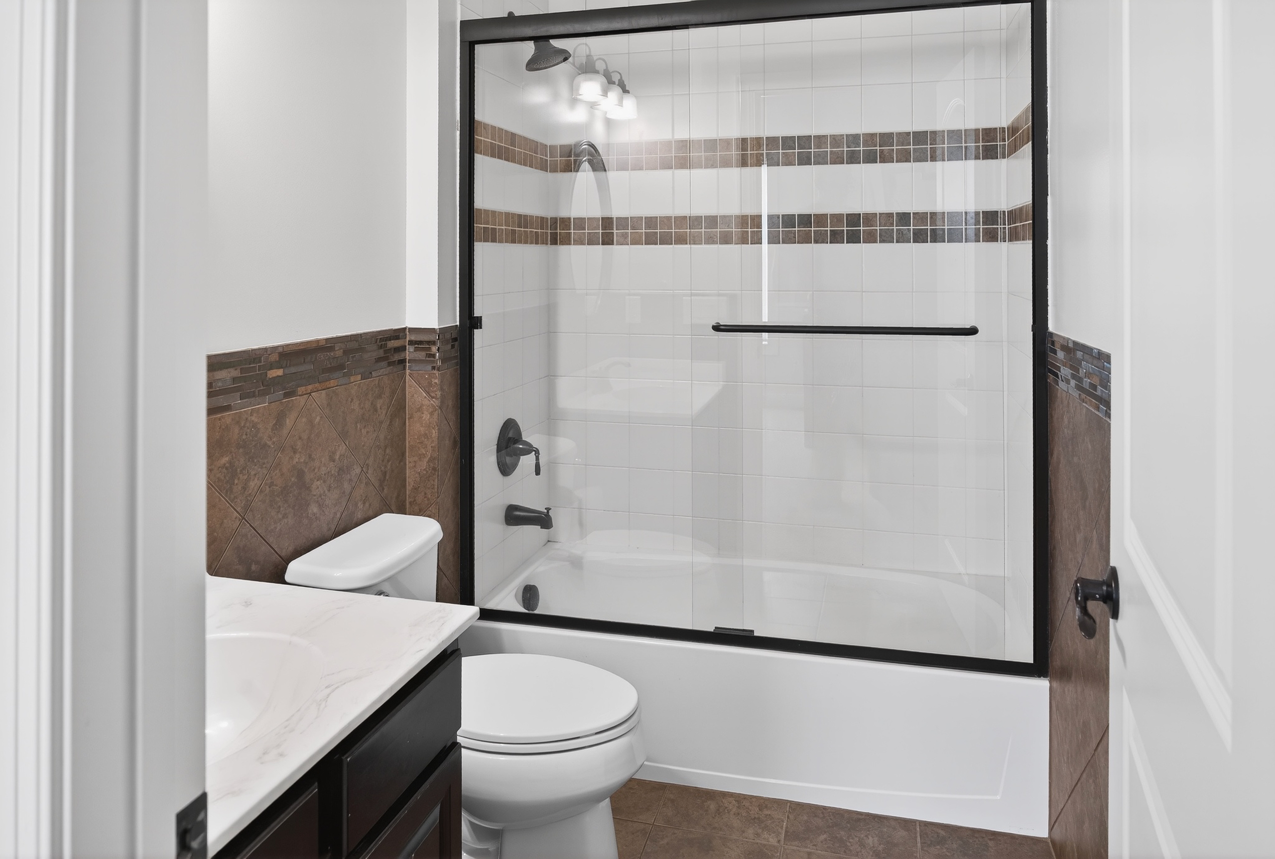 Custom walk-in closet by Twin Cities Closets with built-in shelving