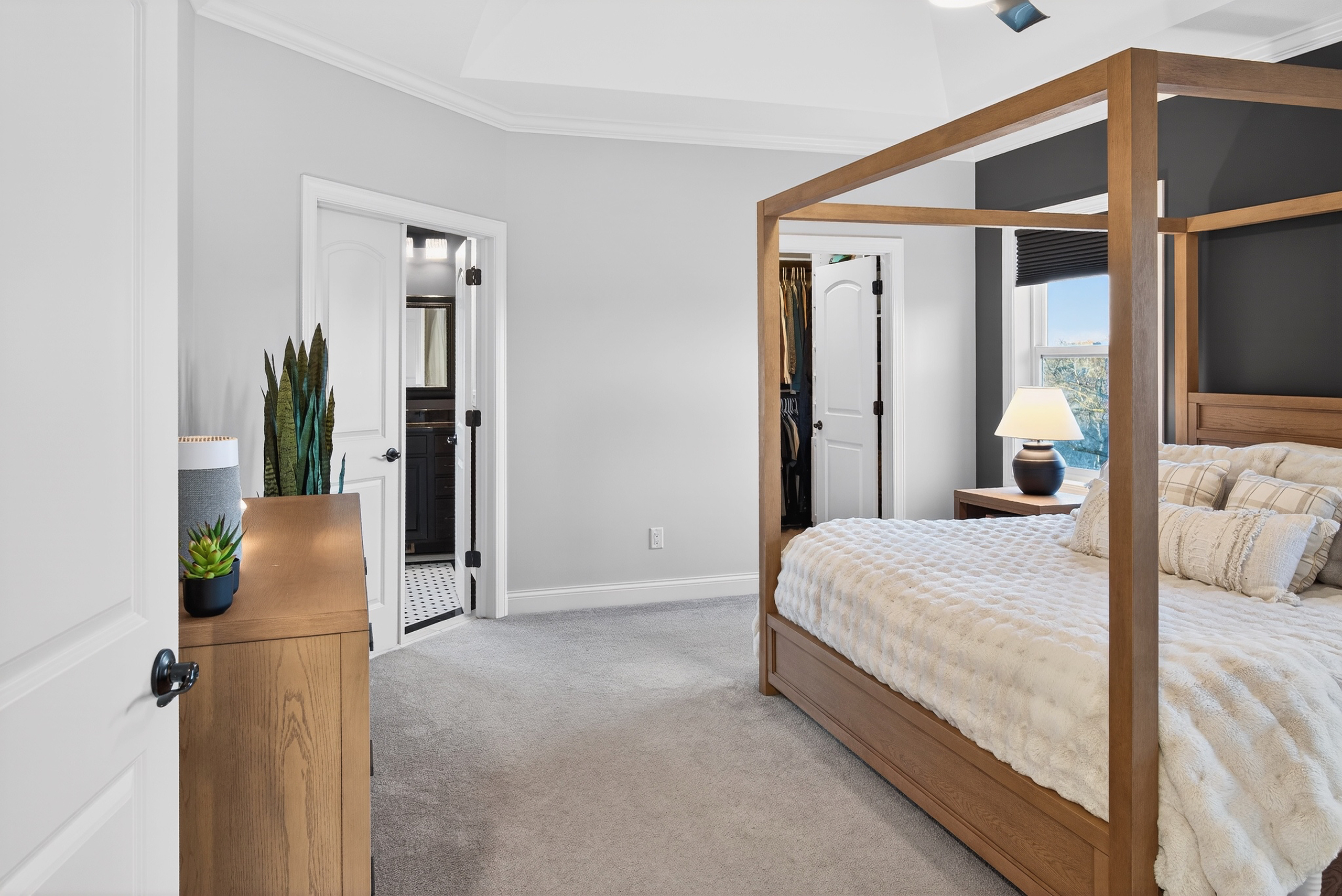 Custom closet system with drawers, shelving, and hanging rods