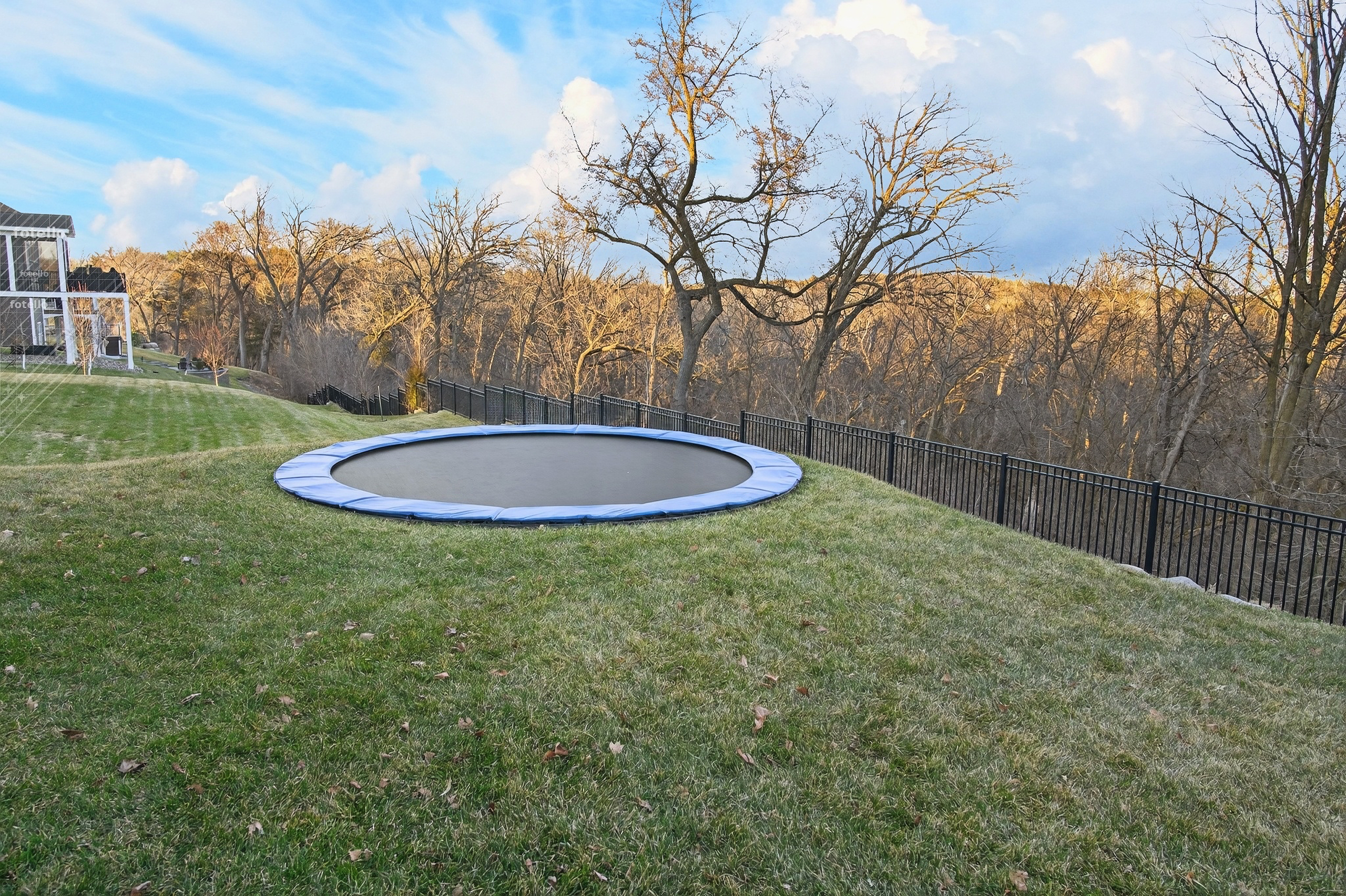In-ground trampoline in backyard